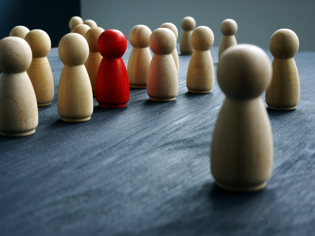 Be Unique, think differently, individuality. Wooden figures and one red figure.の写真素材