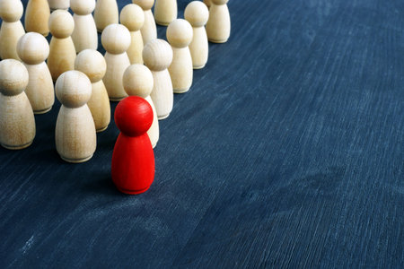 Leadership and management in business. Small figures on the desk.の写真素材