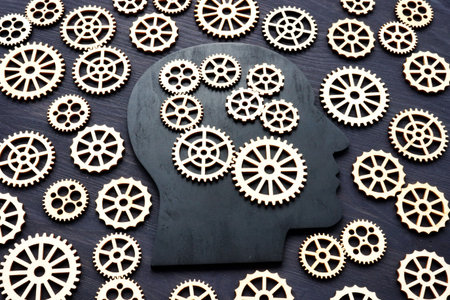 Emotional intelligence EI. Head silhouette with gear wheels.