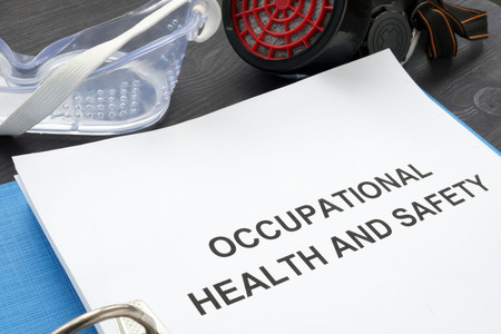 Occupational health and safety ohs act with blue folder.の写真素材
