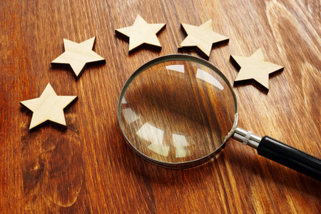 Evaluation and assessment concept. Five stars and magnifying glass.