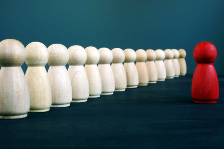 Wooden figurines as symbol of Team leader and staff. Management and leadership.