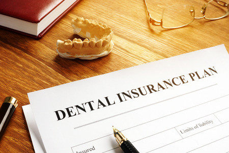 Dental insurance plan policy and glasses.の写真素材