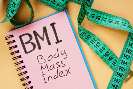 BMI body mass index sign and measuring tape for weight loss.の写真素材