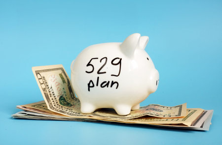 529 college saving plan. Money and piggy bank.