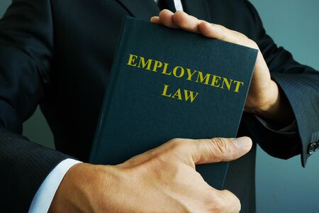 Employment law in the hands of a businessman.の写真素材