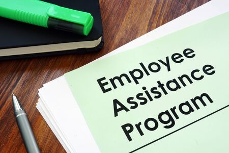 Employee assistance program EAP - benefit program on the desk.