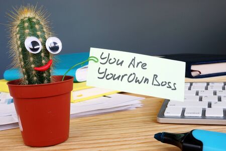 You are your own boss sign on the desk.の写真素材