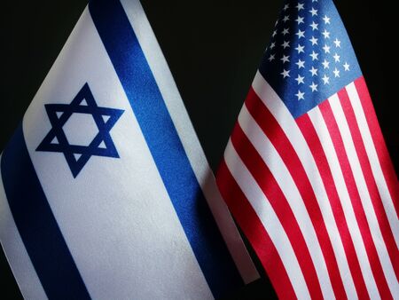 Flags of the USA and Israel in the dark.の写真素材