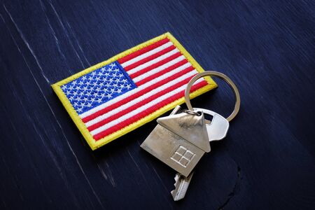 American flag and key from home. VA Streamline Refinance loan concept.の写真素材