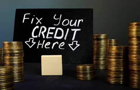 Fix your credit here handwritten sign and money.の写真素材