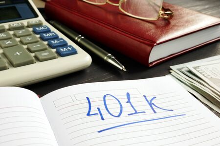401k Retirement plan in the notebook and calculator.の写真素材