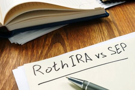 Roth IRA vs SEP handwritten on the yellow sheet.の写真素材