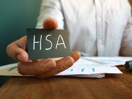 Hand holds Health Savings Accounts HSA inscription.の写真素材