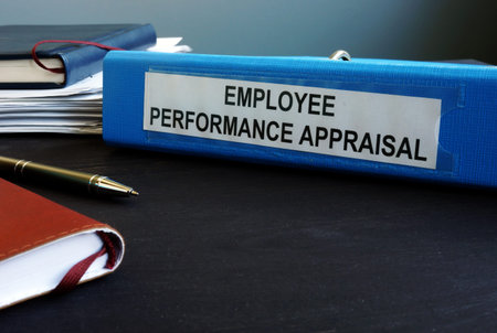 Folder with employee performance appraisal on the desk.の写真素材