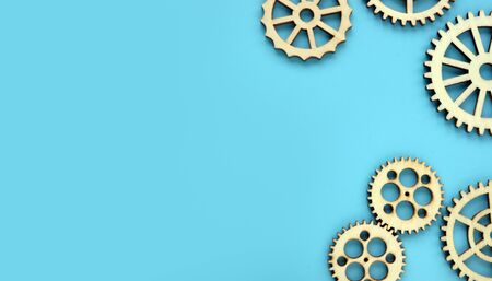Blue background with wooden gears. Mind works and new ideas concept. Free space.の写真素材