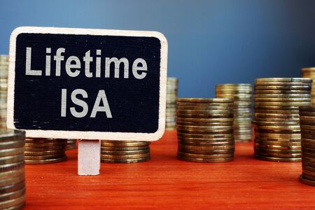 Lifetime ISA Individual Savings Account sign and coins.の写真素材