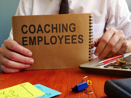 Coaching employees words on the page. Improve performance concept.の写真素材