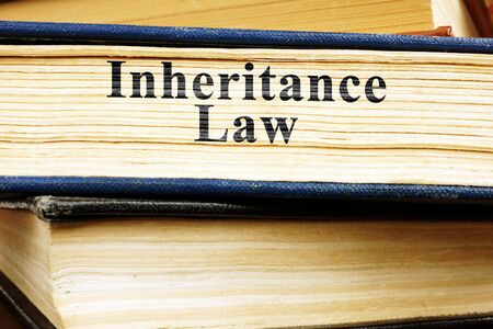 Inheritance law and stack of books.の写真素材