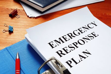 Open folder with Emergency response plan.の写真素材