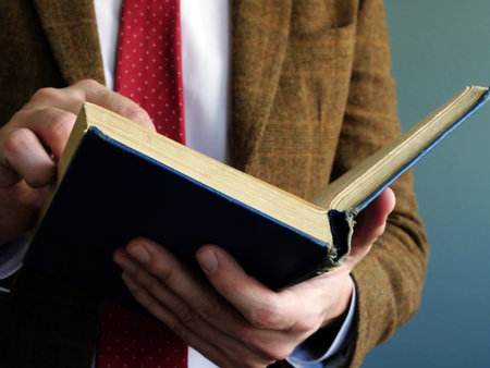Knowledge and wisdom concept. Man reads old book.
