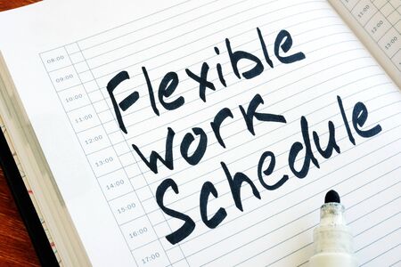 Flexible Work Schedule sign in the notepad.の写真素材