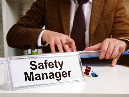 Safety manager works with instructions of OSHA Occupational Safety and Health Administration.の写真素材