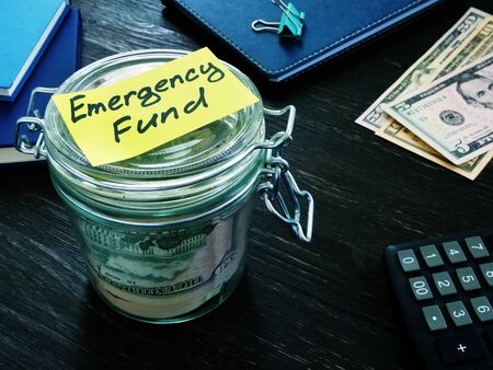 Money for Emergency fund in the glass jar.の写真素材