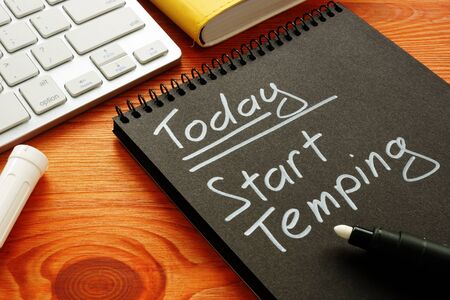 Note in the notebook. Today Start temping. Search for temporary work.の写真素材