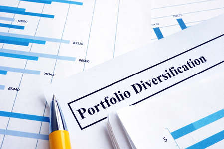 Papers about investment portfolio diversification and pen.の写真素材