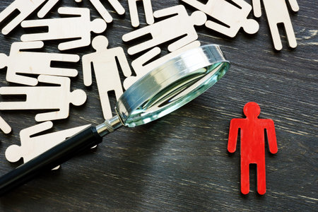 Human resource management and talent choice. Magnifying glass and figures of employees.