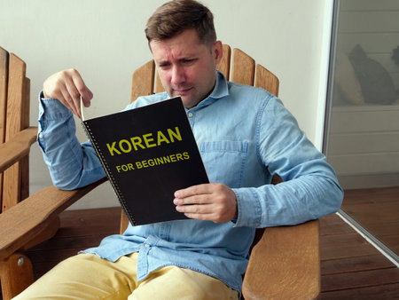 Man learns Korean for beginners at the home.