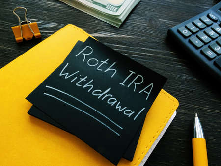 Roth IRA withdrawal words on a black page.の写真素材