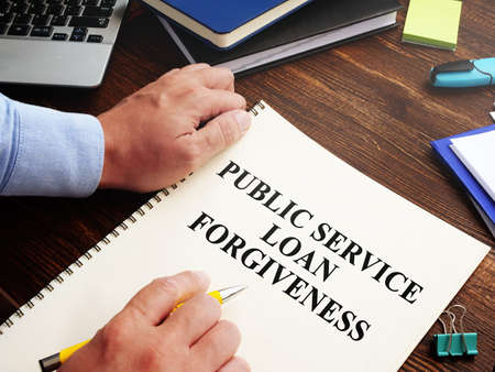 Public service loan forgiveness program PSLF on the desk.の写真素材