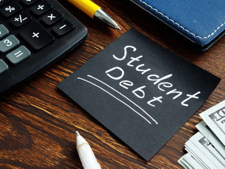 Student debt phrase on the black memo stick.の写真素材