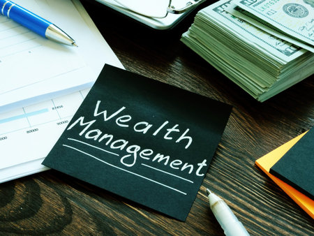 Stack of money and wealth management sign on the black sheet.