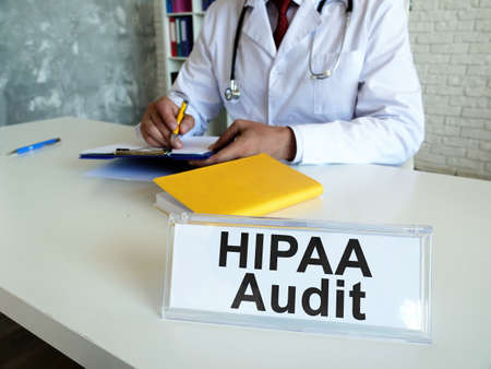 HIPAA audit concept. The doctor works with medical documents.の写真素材
