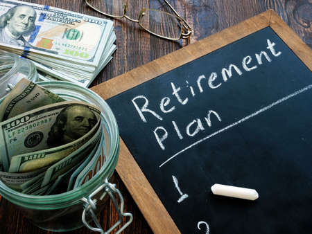 Cash and retirement plan hand written on a blackboard.の写真素材