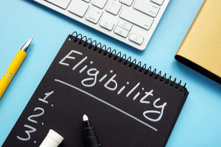 Eligibility list written by pen on the page.の写真素材