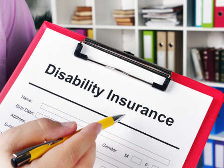 Insurer shows Disability insurance application for signing.の写真素材