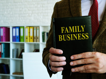 Family business book is in the hands of a financial advisor.