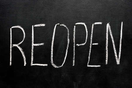 Reopen business after quarantine. Lettering on the board.の写真素材