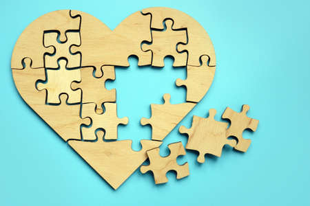 Heart made from puzzle pieces. Disease and treatment symbol.の写真素材