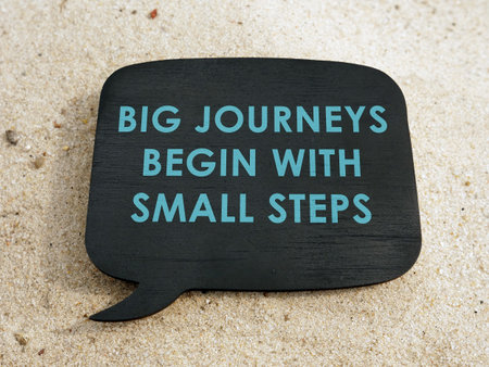 Big journeys begin with small steps motivation phrase on the plate.