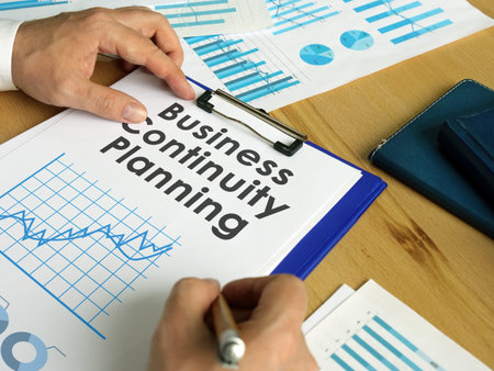 Business continuity planning BCP concept. Manager with graphs and charts.の写真素材
