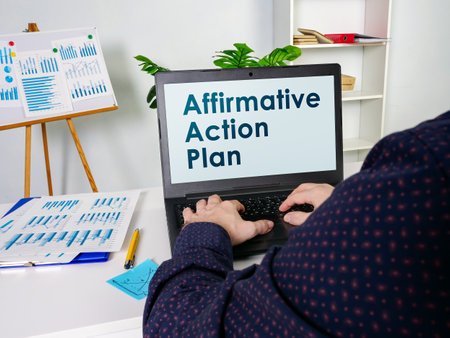 Manager reads about Affirmative Action Plan AAP.の写真素材