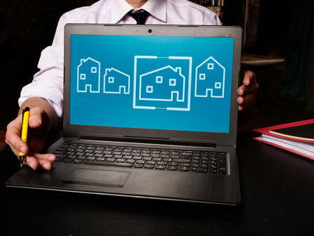 The realtor offers to choose a property. Real estate evaluation.の写真素材