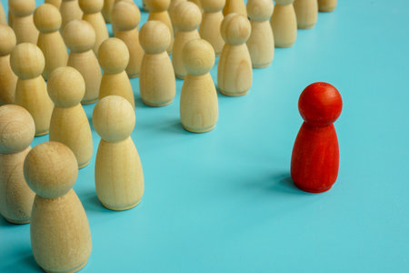 Red figure stands out from the crowd. Be unique and different concept.の写真素材