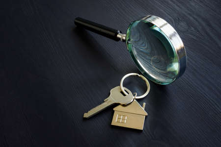 Magnifying glass and key for home. Property appraisal concept.の写真素材