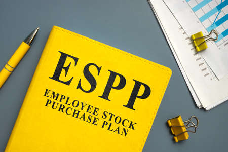 Employee Stock Purchase Plan ESPP and papers with charts and pen.の写真素材